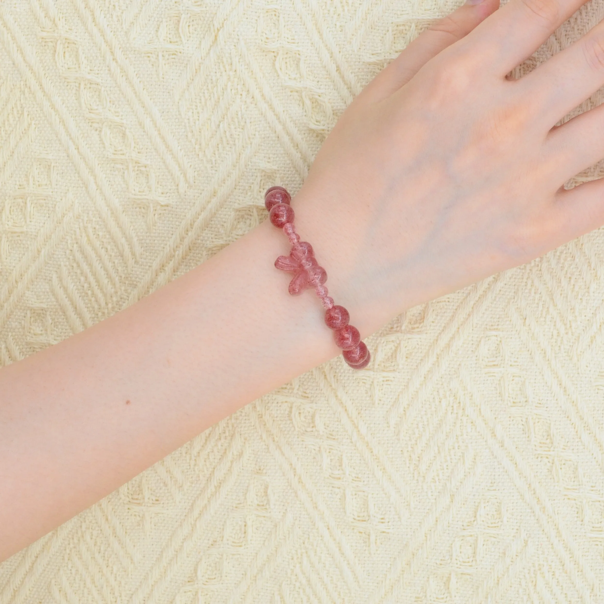 A natural strawberry crystal bracelet that attracts love