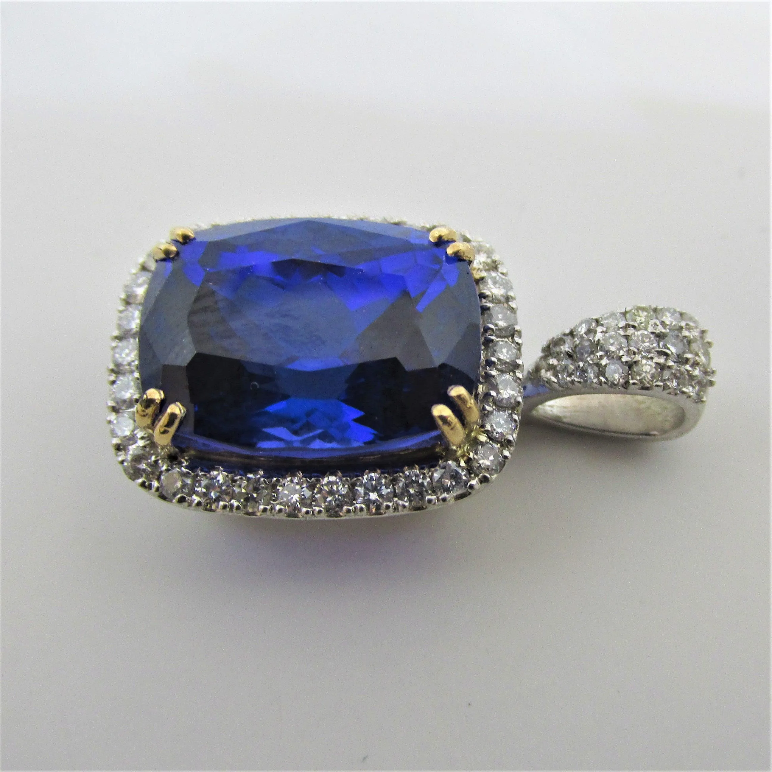 Tanzanite and Diamond Halo 2 Tone Gold Pendant