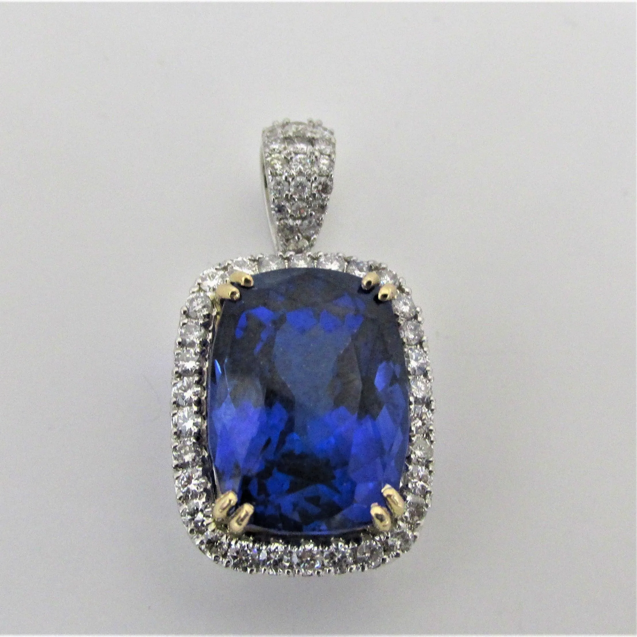 Tanzanite and Diamond Halo 2 Tone Gold Pendant